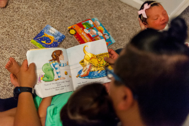 David reads a Biscuit book to Selah and Annabelle.
