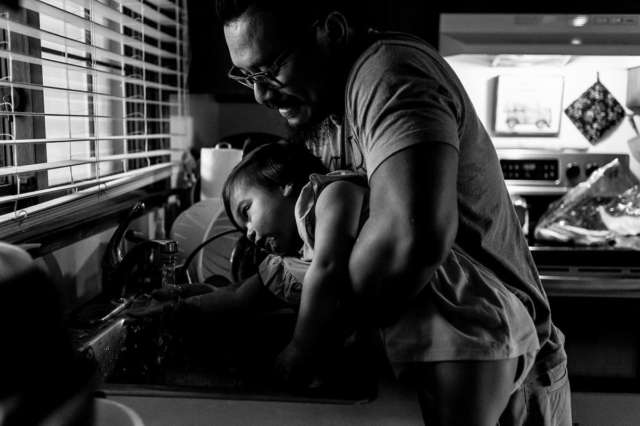 David helps Annabelle wash her hands after eating her lunch.