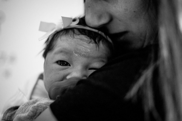 Newborn Selah looking at camera.