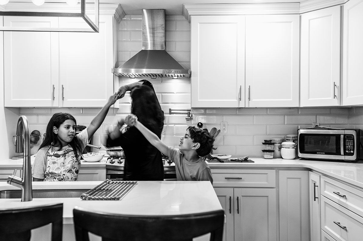 Sharon and her children dance in the kitchen to classic oldies.
