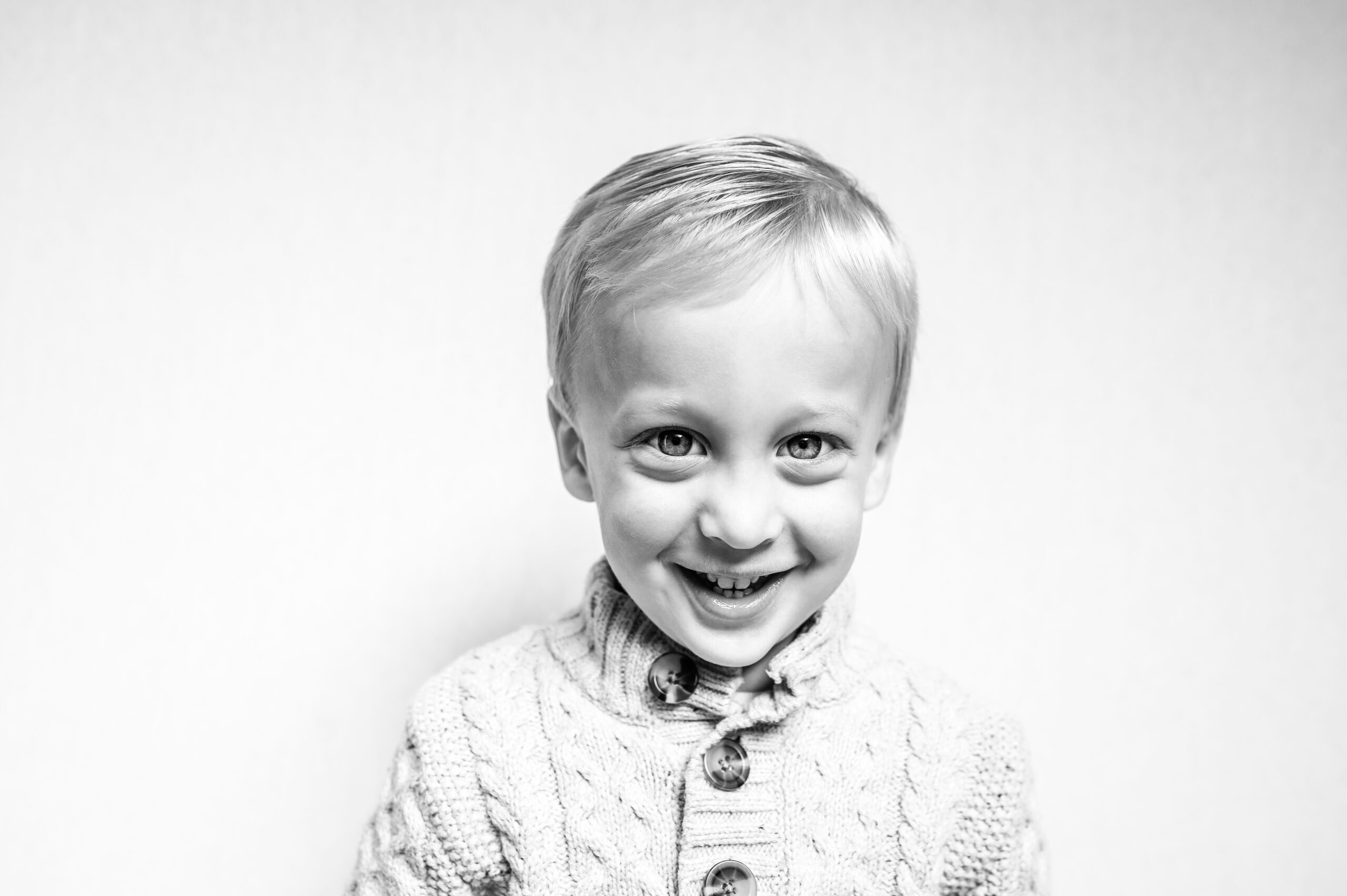 Little boy smiles big during picture day.