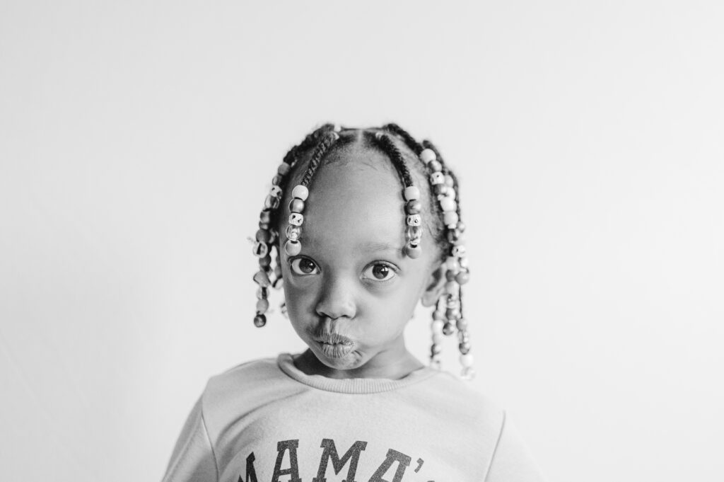 Little girl being sassy and having fun during portrait party.