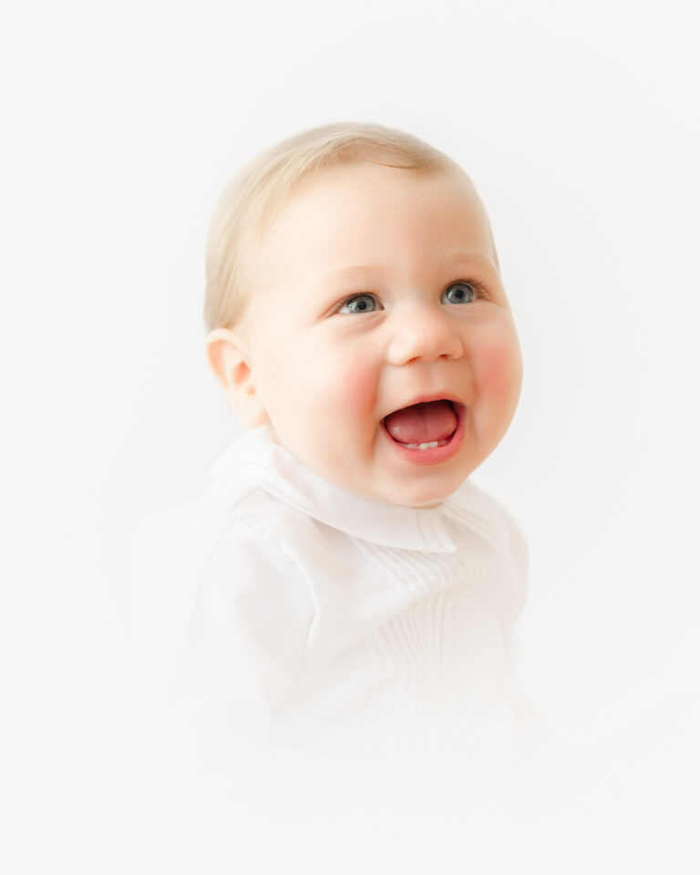 Toddler boy smiles with two bottom teeth during Williamsburg Virginia photographer.