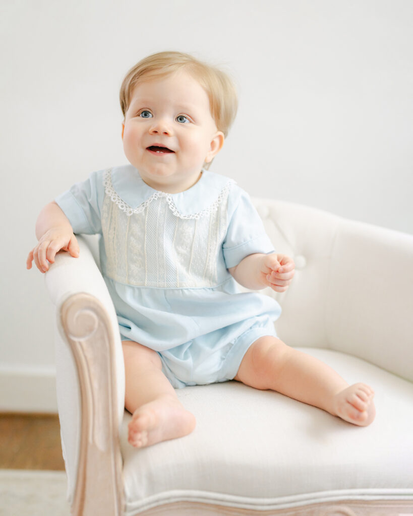 Little boy sits in chair during his lifestyle session with Dreama Spence.