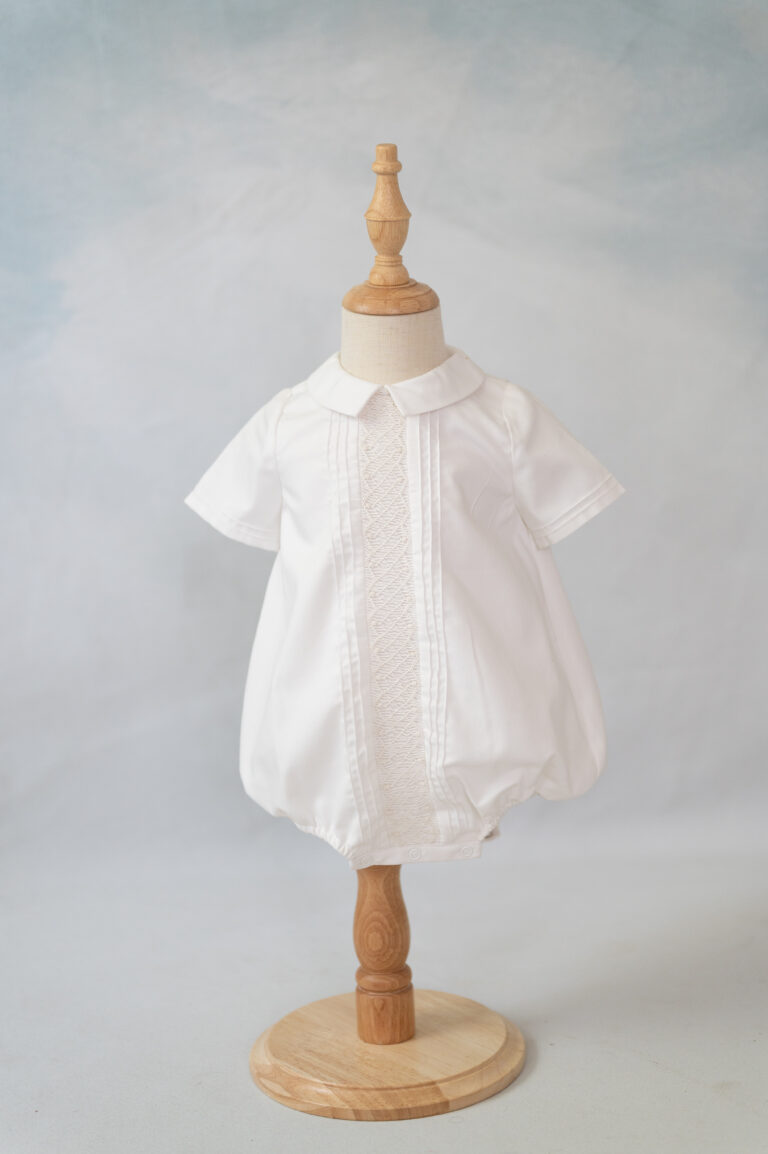 Slight ivory boys smocked bubble for heirloom photography.