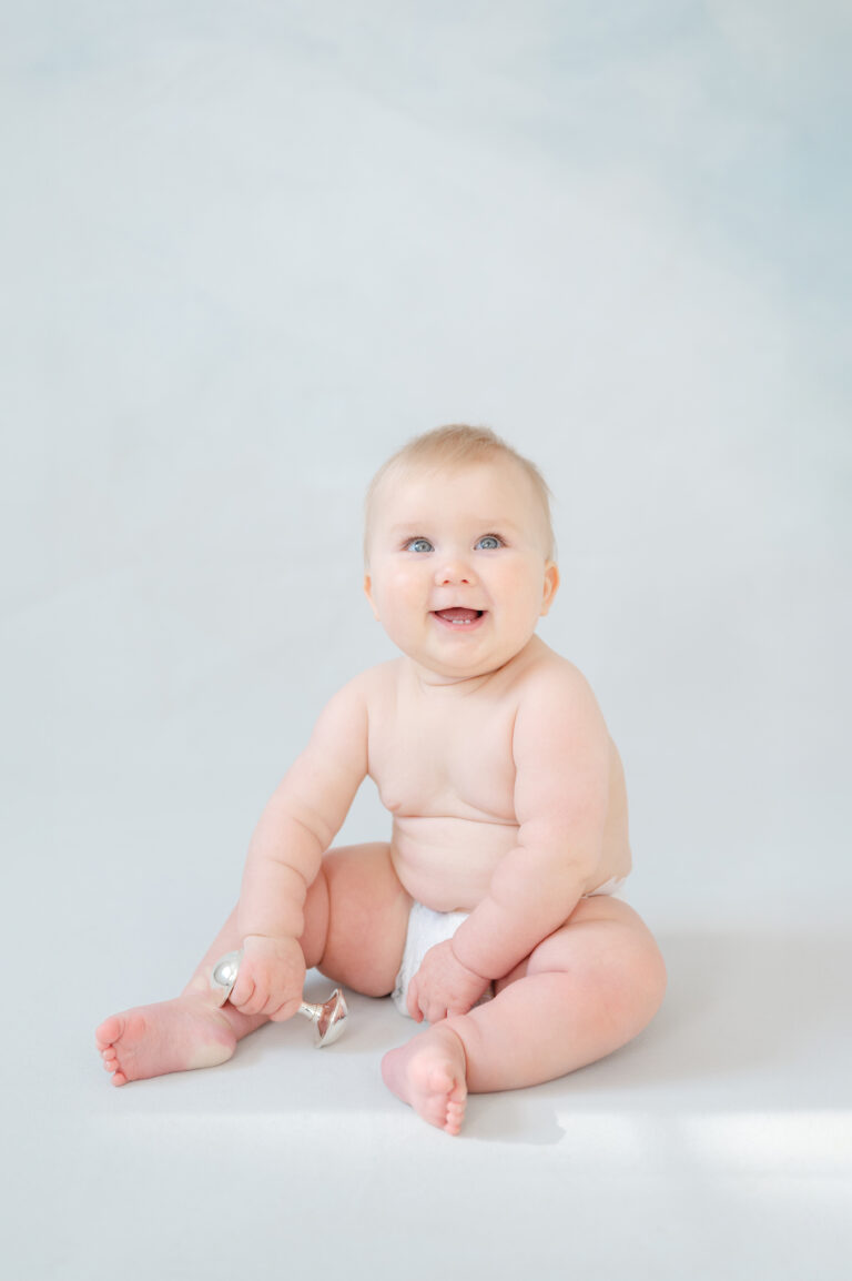 Child’s milestone session in Williamsburg studio with natural light and soft pastel tones.