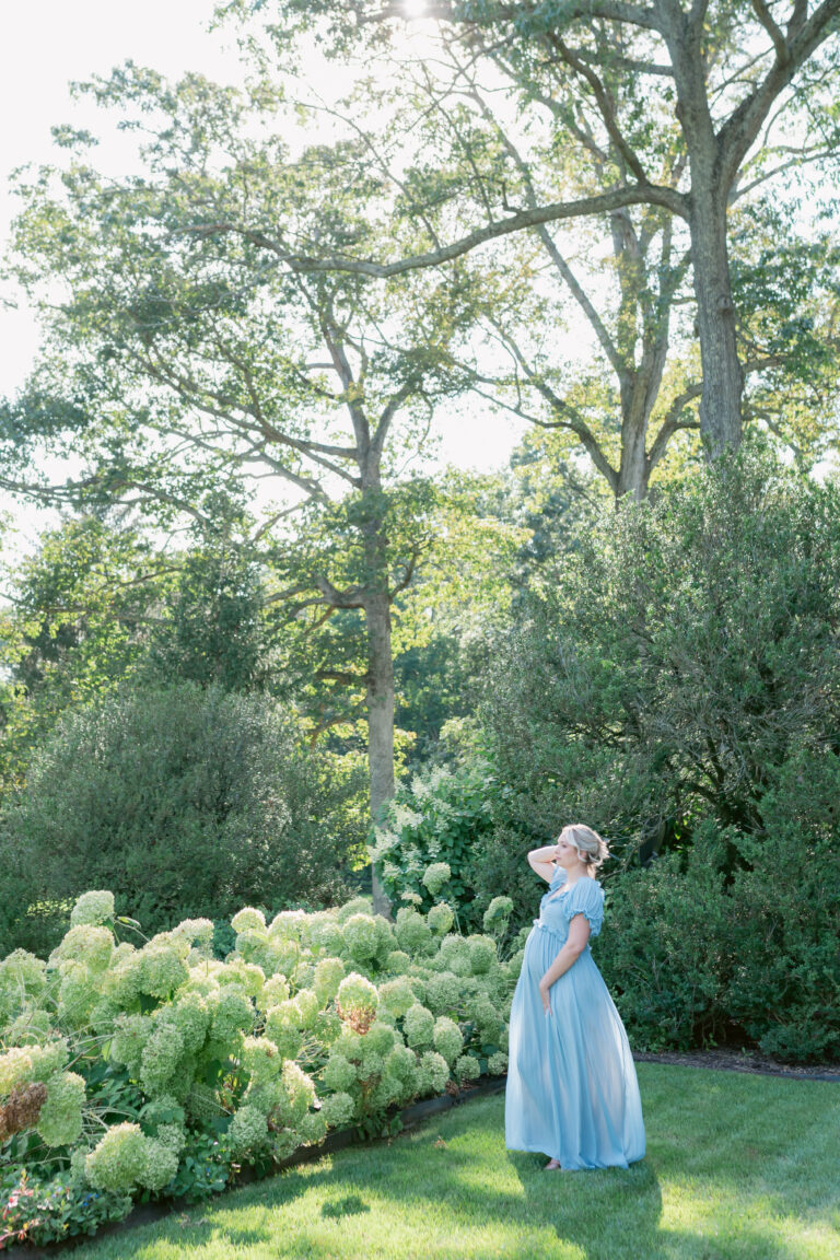 Virginia Beach maternity photographer capturing outdoor garden portrait of expecting mother.