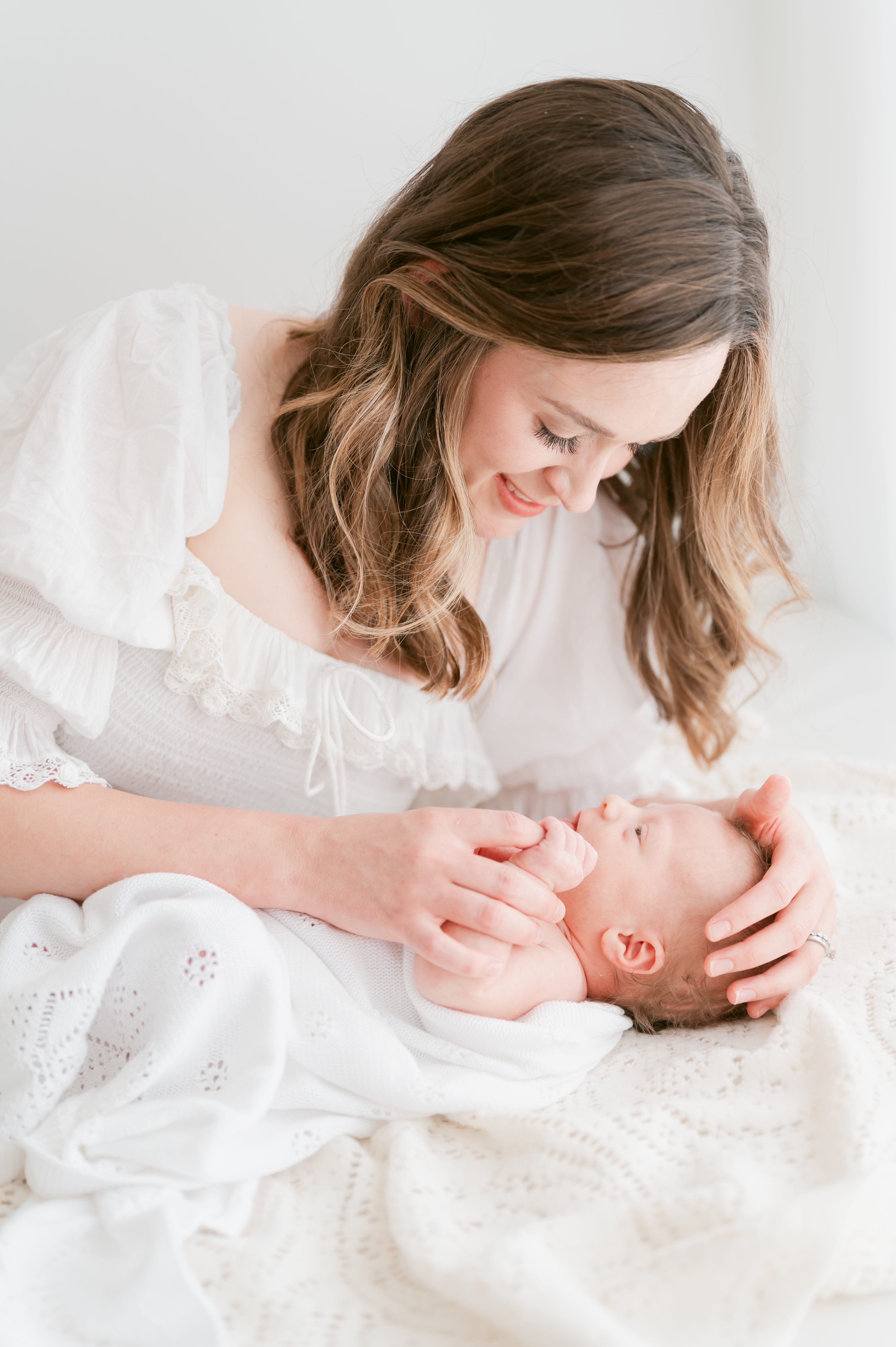 norfolk-newborn-photographer-studio-mother-laying-next-baby