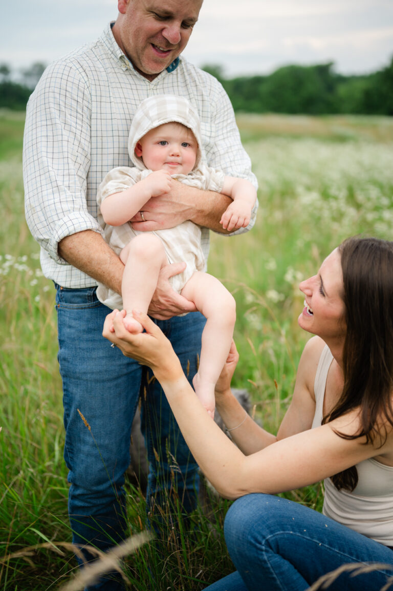 Mom tickles toddlers toes during Williamsburg, Va family session.
